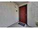 Exterior entryway with a burgundy door and address number at 950 Seven Hills Dr # 2413, Henderson, NV 89052