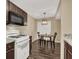 Bright kitchen with granite countertops and white appliances at 950 Seven Hills Dr # 2413, Henderson, NV 89052