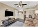 Living room features dark wood floors and a ceiling fan at 950 Seven Hills Dr # 2413, Henderson, NV 89052