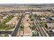 Aerial view of community with houses, pools, and city views at 9523 Castillana Ct, Las Vegas, NV 89147