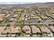 Aerial view of community with houses, pools, and palm trees at 9523 Castillana Ct, Las Vegas, NV 89147