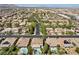 Aerial view of a residential neighborhood with houses, pools, and lush landscaping at 9523 Castillana Ct, Las Vegas, NV 89147