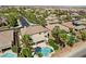 Aerial view of a house featuring a pool and backyard oasis with palm trees at 9523 Castillana Ct, Las Vegas, NV 89147