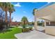 Landscaped backyard with a pool, artificial turf, and patio at 9523 Castillana Ct, Las Vegas, NV 89147