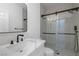 Modern bathroom with a frameless glass shower and marble vanity at 9523 Castillana Ct, Las Vegas, NV 89147