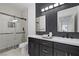 Modern bathroom with double vanity and walk-in shower at 9523 Castillana Ct, Las Vegas, NV 89147