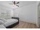 Spacious bedroom with wood floors and ceiling fan at 9523 Castillana Ct, Las Vegas, NV 89147