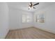 Well-lit bedroom with wood floors and window shutters at 9523 Castillana Ct, Las Vegas, NV 89147