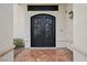 Elegant entryway with black wrought iron double doors at 9523 Castillana Ct, Las Vegas, NV 89147