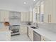 Bright kitchen with stainless steel appliances and white cabinets at 9523 Castillana Ct, Las Vegas, NV 89147