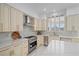 Modern kitchen with white cabinets, stainless steel appliances, and quartz countertops at 9523 Castillana Ct, Las Vegas, NV 89147