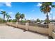 Private patio with a view of palm trees and neighboring community at 9523 Castillana Ct, Las Vegas, NV 89147