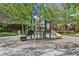 playground with slide, climbing structures, and shaded area at 9523 Castillana Ct, Las Vegas, NV 89147