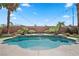 Inviting kidney-shaped pool with a spa and string lights at 9523 Castillana Ct, Las Vegas, NV 89147