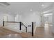 Upstairs hallway with light wood floors and white walls at 9523 Castillana Ct, Las Vegas, NV 89147