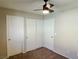 Bedroom with double door closet and ceiling fan at 1175 Lake Berryessa St, Henderson, NV 89002