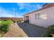 Landscaped backyard with gravel and a covered patio at 1431 Di Blasi Dr # 105, Las Vegas, NV 89119