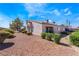 Backyard view of patio, landscaping, and exterior at 1431 Di Blasi Dr # 105, Las Vegas, NV 89119
