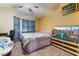 Bright bedroom with a large bed, TV, and ample closet space at 1431 Di Blasi Dr # 105, Las Vegas, NV 89119