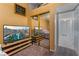 Bedroom with mirrored closet doors and access to the hallway at 1431 Di Blasi Dr # 105, Las Vegas, NV 89119