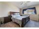Primary bedroom with a king-size bed and ceiling fan at 1431 Di Blasi Dr # 105, Las Vegas, NV 89119