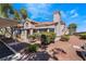 Spanish-style home with covered parking and desert landscaping at 1431 Di Blasi Dr # 105, Las Vegas, NV 89119