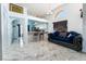 Open kitchen with a breakfast bar and white cabinets at 1431 Di Blasi Dr # 105, Las Vegas, NV 89119