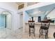 Kitchen boasts a breakfast bar and white cabinets at 1431 Di Blasi Dr # 105, Las Vegas, NV 89119