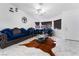 Bright living room with marble floors and blue velvet furniture at 1431 Di Blasi Dr # 105, Las Vegas, NV 89119