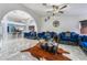 Spacious living room with marble floors and stylish blue velvet furniture at 1431 Di Blasi Dr # 105, Las Vegas, NV 89119
