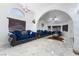 Spacious living room featuring marble floors and elegant blue velvet sofas at 1431 Di Blasi Dr # 105, Las Vegas, NV 89119