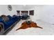 Bright living room with marble floors and blue velvet furniture at 1431 Di Blasi Dr # 105, Las Vegas, NV 89119
