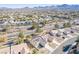 Aerial view of a house with solar panels, desert landscaping, and mountain views at 1466 Fieldbrook St, Henderson, NV 89052