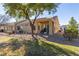 Landscaped backyard with a covered patio and grassy area at 1466 Fieldbrook St, Henderson, NV 89052