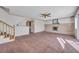 Bright living room featuring a fireplace and carpet at 1505 Frandosa Ln, Las Vegas, NV 89117