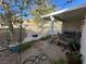 Small backyard with covered patio and grill at 2148 Pebble Creek Ln, Laughlin, NV 89029