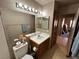 Clean bathroom with single sink vanity, toilet and shower at 2148 Pebble Creek Ln, Laughlin, NV 89029