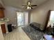 Dining area with patio access, flooring, and ceiling fan at 2148 Pebble Creek Ln, Laughlin, NV 89029