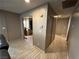 Hallway with light taupe walls and wood-look vinyl flooring at 2148 Pebble Creek Ln, Laughlin, NV 89029