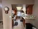 Galley kitchen with wood cabinets and updated appliances at 2148 Pebble Creek Ln, Laughlin, NV 89029