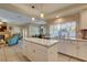 Spacious kitchen with a large island, white cabinets, and stainless steel appliances at 2430 Antler Point Dr, Henderson, NV 89074