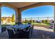 Covered patio with dining table and seating at 270 Besame Ct, Las Vegas, NV 89138