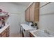 Convenient laundry room with washer, dryer, and extra storage at 2714 Thomasville Ave, Henderson, NV 89052