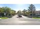 Elegant community entrance with manicured landscaping and signage at 312 N Royal Ascot Dr, Las Vegas, NV 89144