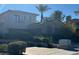 Beautiful multi-story home with a lush landscaped yard and an attached garage at 312 N Royal Ascot Dr, Las Vegas, NV 89144