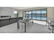 Modern dining area with lake view and kitchen access at 32 Grand Corniche Dr, Henderson, NV 89011