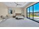 Bright bedroom with lake view and large sliding doors at 32 Grand Corniche Dr, Henderson, NV 89011