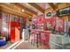 Rustic bar with red accents and vintage decor at 5353 Dorrell Ln, Las Vegas, NV 89131
