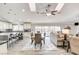 Open concept dining area with wood table and access to kitchen at 5353 Dorrell Ln, Las Vegas, NV 89131