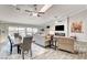 Open dining area with wood table, chairs, and view to living room at 5353 Dorrell Ln, Las Vegas, NV 89131